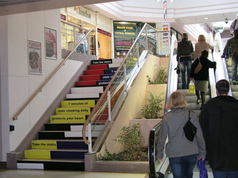 People not taking stairs and take electric stairs, where posters are placed to urge them to take stairs for better health, later they followed the educational advice and have been taking the stairs.